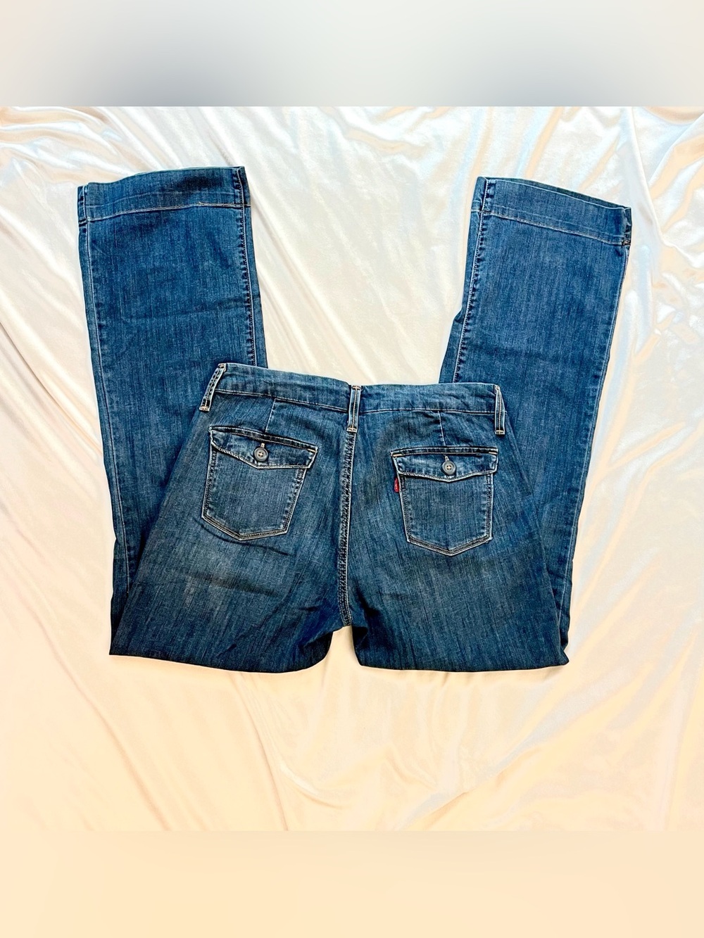 Vintage Levi’s Low Waisted Jeans with button details and flower print lining.